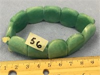 Stretch bracelet with green stone, possibly jade