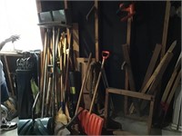 Collection of long handled tools and golf clubs