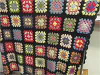 A9 Afghan w. colorful squares, bound in black