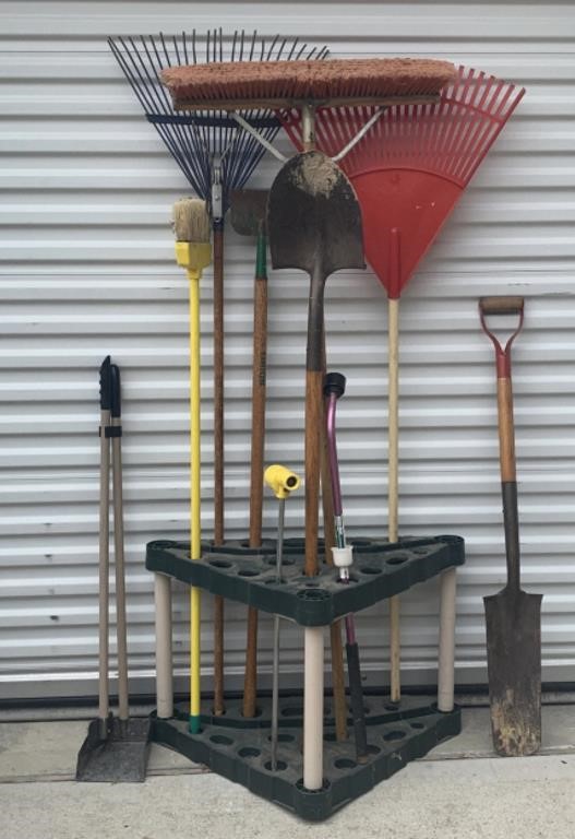 Selection Of Yard Tools In Stand