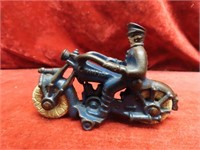 Blue cast iron Champion motorcycle toy.