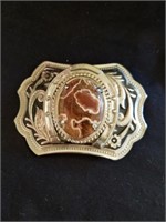 Vintage belt buckle with a stone in the center