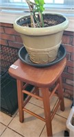 Barstool plant stand with flower