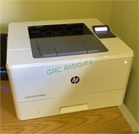 HP LaserJet Pro M402N printer in the back office