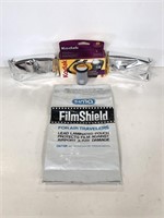 Three Kodak disposal cameras, film, and FilmShield