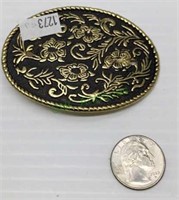 Belt buckle - black and gold tone accent.   1273