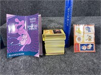 4” stack of Pokémon cards, stickers, and book