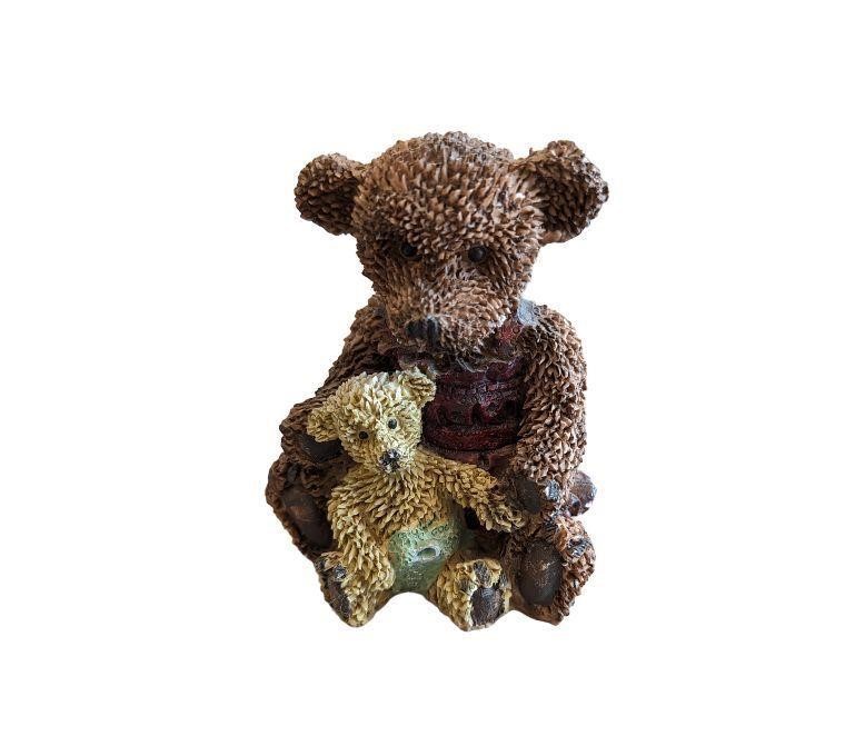 Single Teddy Bear holding baby Bear
