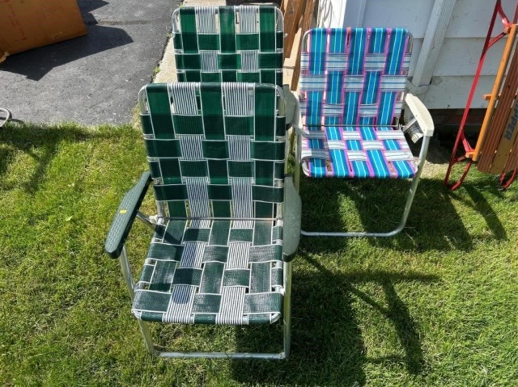 Three folding lawn chairs