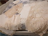Cream colored crocheted doilies and tablecloths