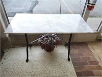 Marble Table with Cast Iron base.