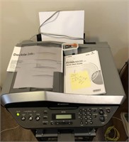 Canon MX310 printer. Lot includes paper and extra
