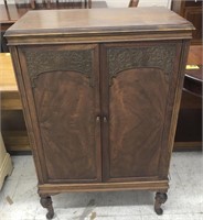 Vintage wooden cabinet measuring 26.5” across 16”