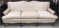 Tilles champagne striped couch with ornate wood