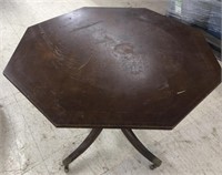 Octagon wooden table measuring 42” across and 29”