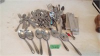 Assorted silverware and large serving spoons