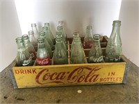 Coca-Cola crate with Coca-Cola bottles some