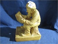 carved man reading .