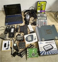 Tub of electronics, laptop, and computer