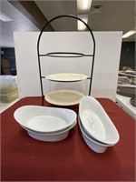 4 white oval porcelain bowls and display rack