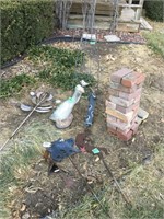 concrete geese, pile bricks, lawn ornaments