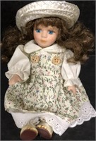 8" PORCELAIN DOLL W/ FLORAL DRESS AND STRAW HAT
