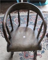 Antique wood child's rocking chair.
