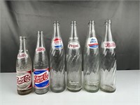 Collection of Pepsi bottles embossed printed