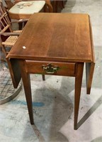 Cherrywood drop leaf side table with one drawer