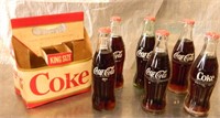6 Coke Bottles