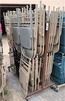 approxmently 58 metal folding chairs with rack