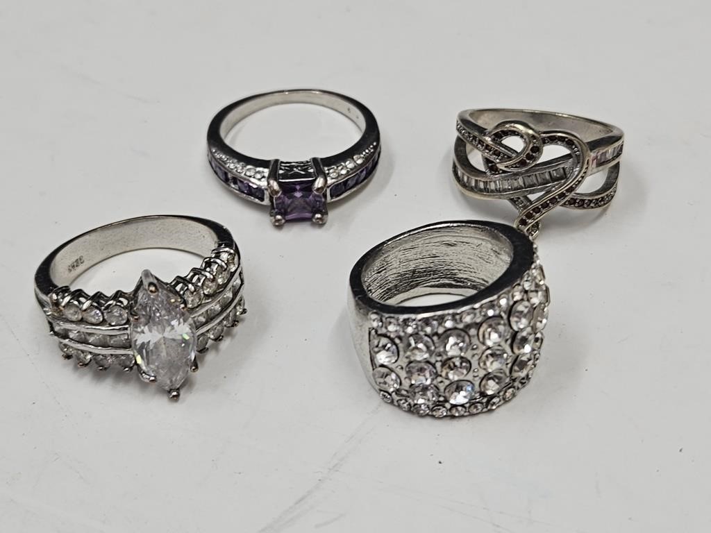 4 Various Size Rings .marked 925 Silver