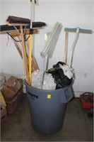 Garbage can full of brooms & Mops