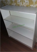 Four shelf white laminate bookcase. 4 feet tall, 3