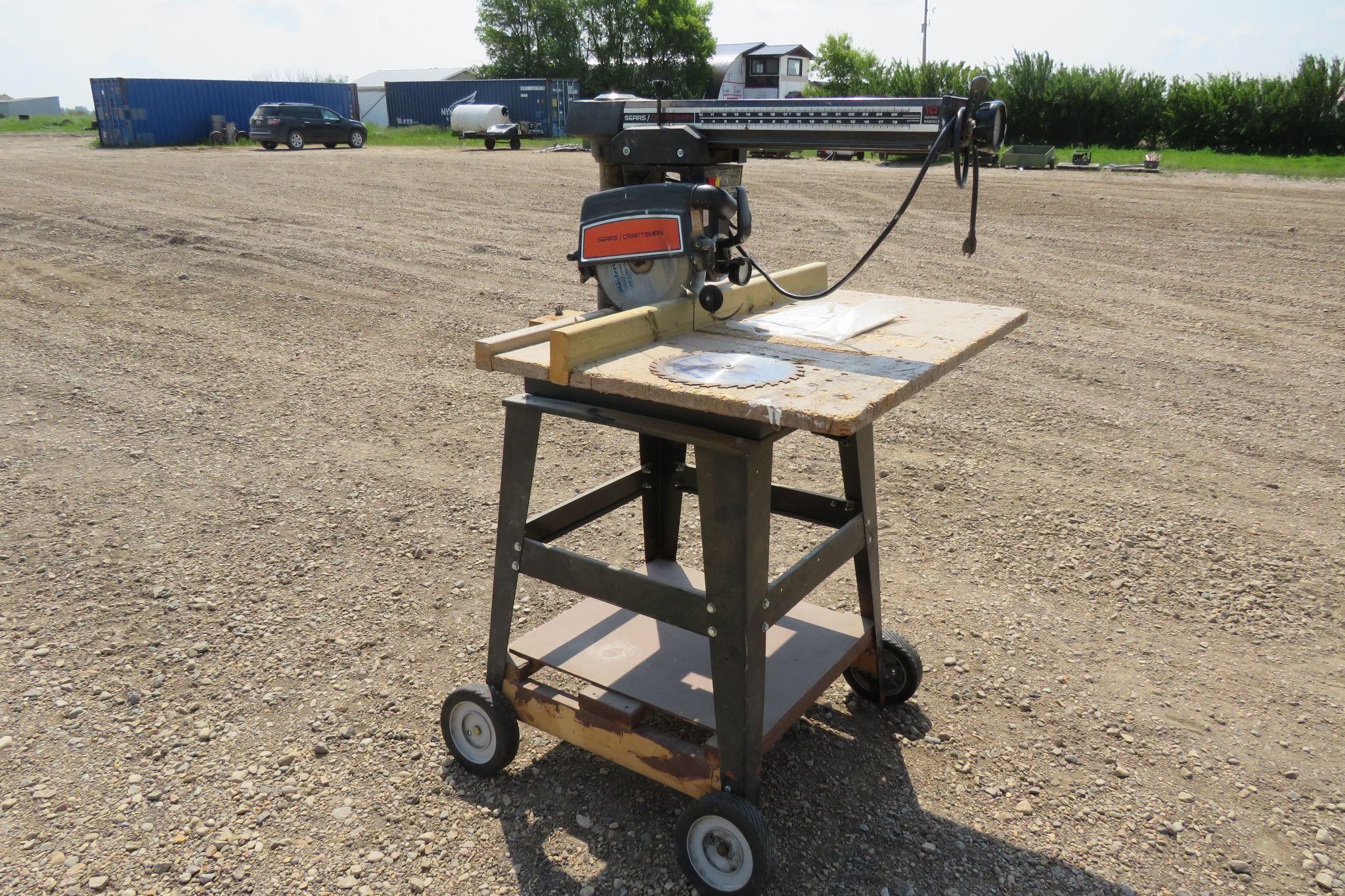 SEARS CRAFTSMAN 10" RADIAL ARM SAW ON ROLLERS