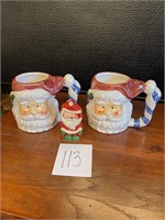 Santa mugs and Christmas candle