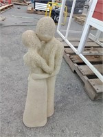 Concrete Couple Embracing Statue