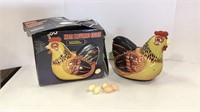 Vintage battery operated hen laying eggs with