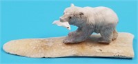 Moose antler carving of a bear and fish on ivory f