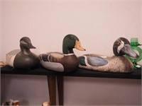 Three duck decoys: two are wood and one