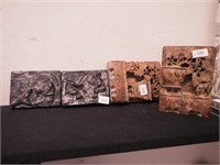 Two pairs of soapstone carved items including