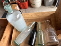 Vintage clear bottles and one black bottle