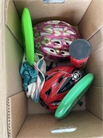 bike helmets, frisbee, and tennis balls