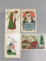 Lot of four Green-coated Santa Claus postcards.