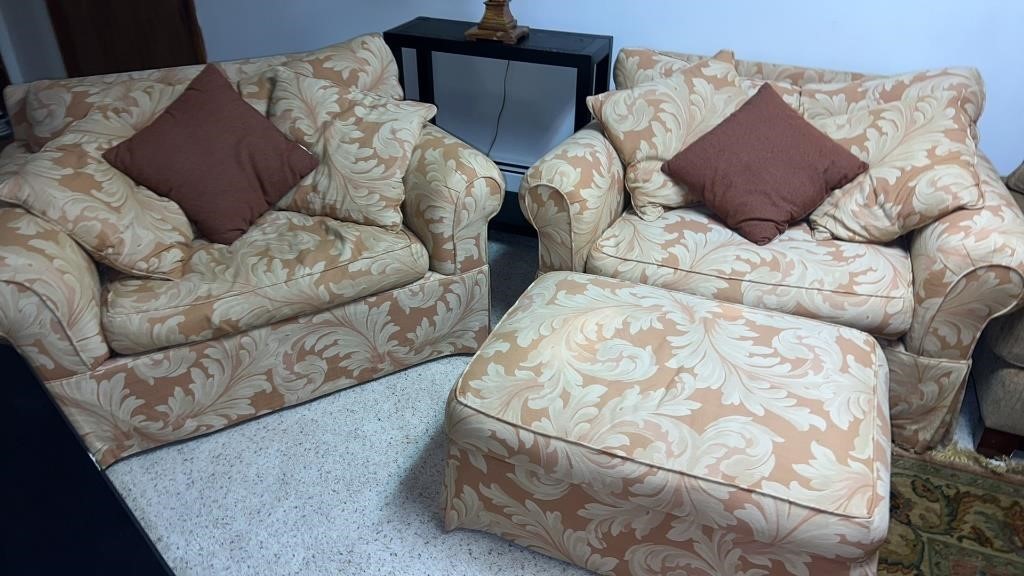 2 oversized chairs with cushions and ottomans