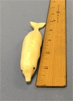 4.75" carved ivory dolphin        (700)