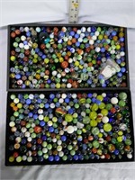Two Jars of assorted marbles including shooters, s