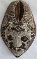 CARVED AFRICAN MASK SHOWING SCARIFICATION