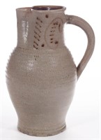 GERMAN DECORATED STONEWARE PITCHER, approximately