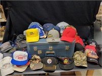 Vintage blue suitcase full of hats